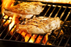 chicken cooking on barbecue grill