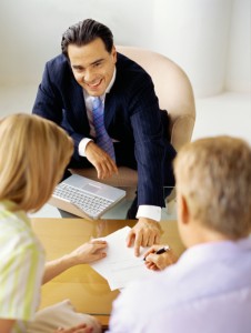photo of couple signing a contract